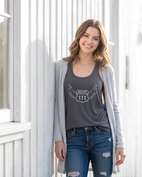 Woman wearing a dark gray 111 angel number tank top with a vintage, distressed look.