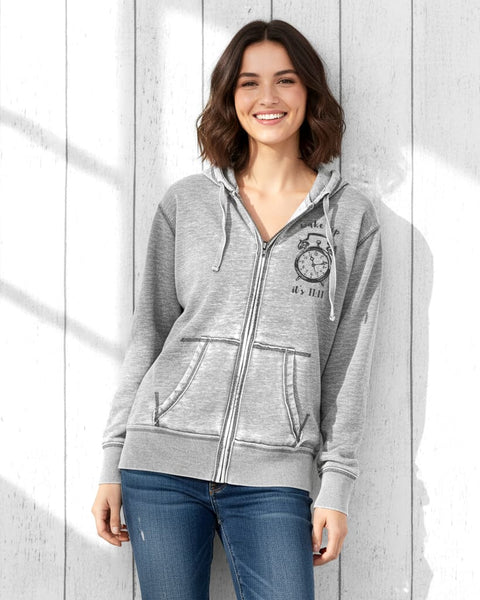 Woman wearing a gray vintage‑style zip‑up hoodie with a distressed burnout fleece look and an 11:11 angel number clock design on the left chest.