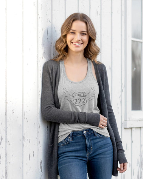 Woman wearing a heather gray 222 angel number tank top with a vintage, distressed look.