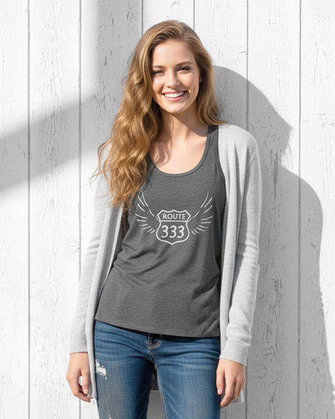 Woman wearing a dark gray 333 angel number tank top with a vintage, distressed look.